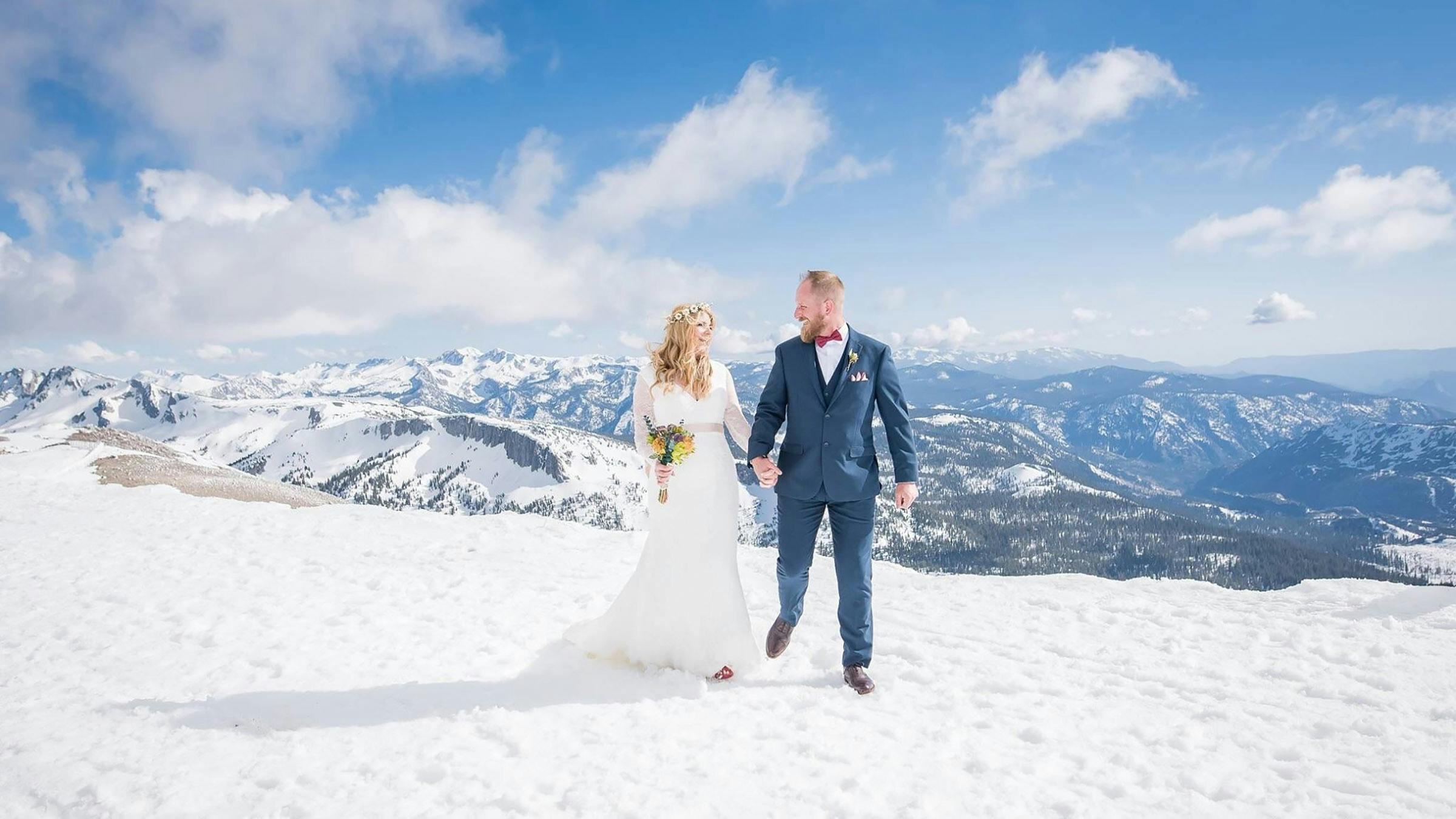 Bride and groom in the snow on the summit of Mammoth Mountain