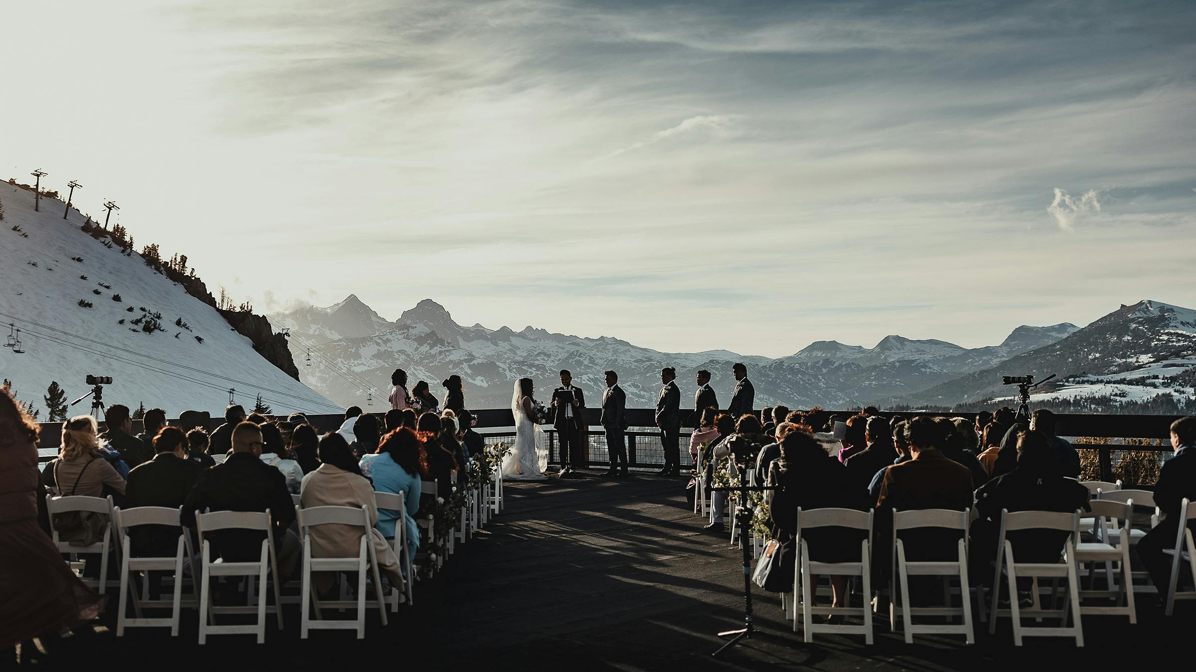 Wedding ceremony on Mammoth Mountain with rows of chairs in the foreground and view of the Minarets in the background