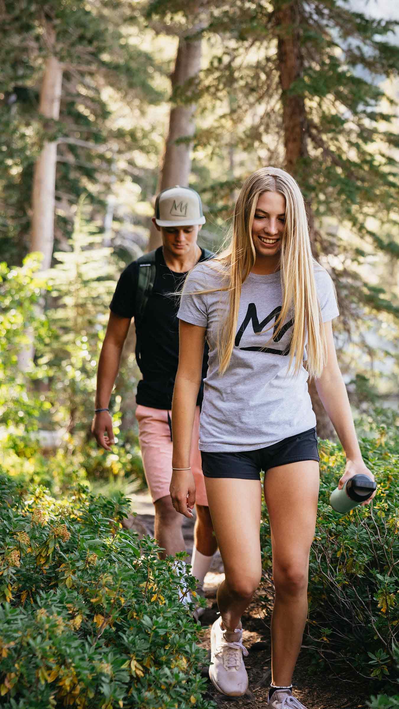 Two people hiking in the Lakes Basin near Mammoth Mountain.