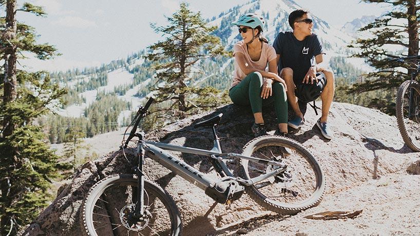 Couple taking a break from mountain biking