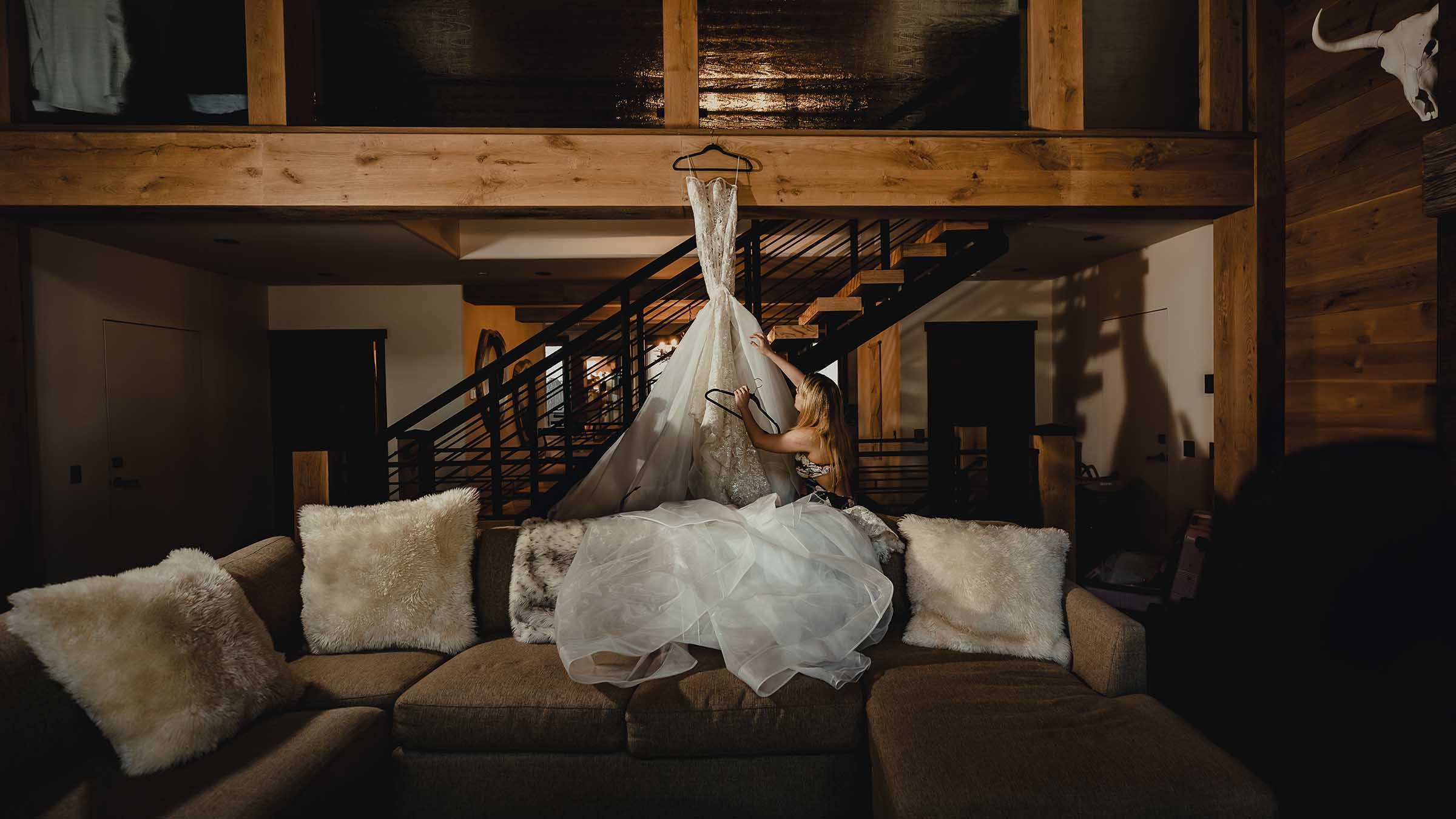 Wedding dress hanging in a luxury home rental