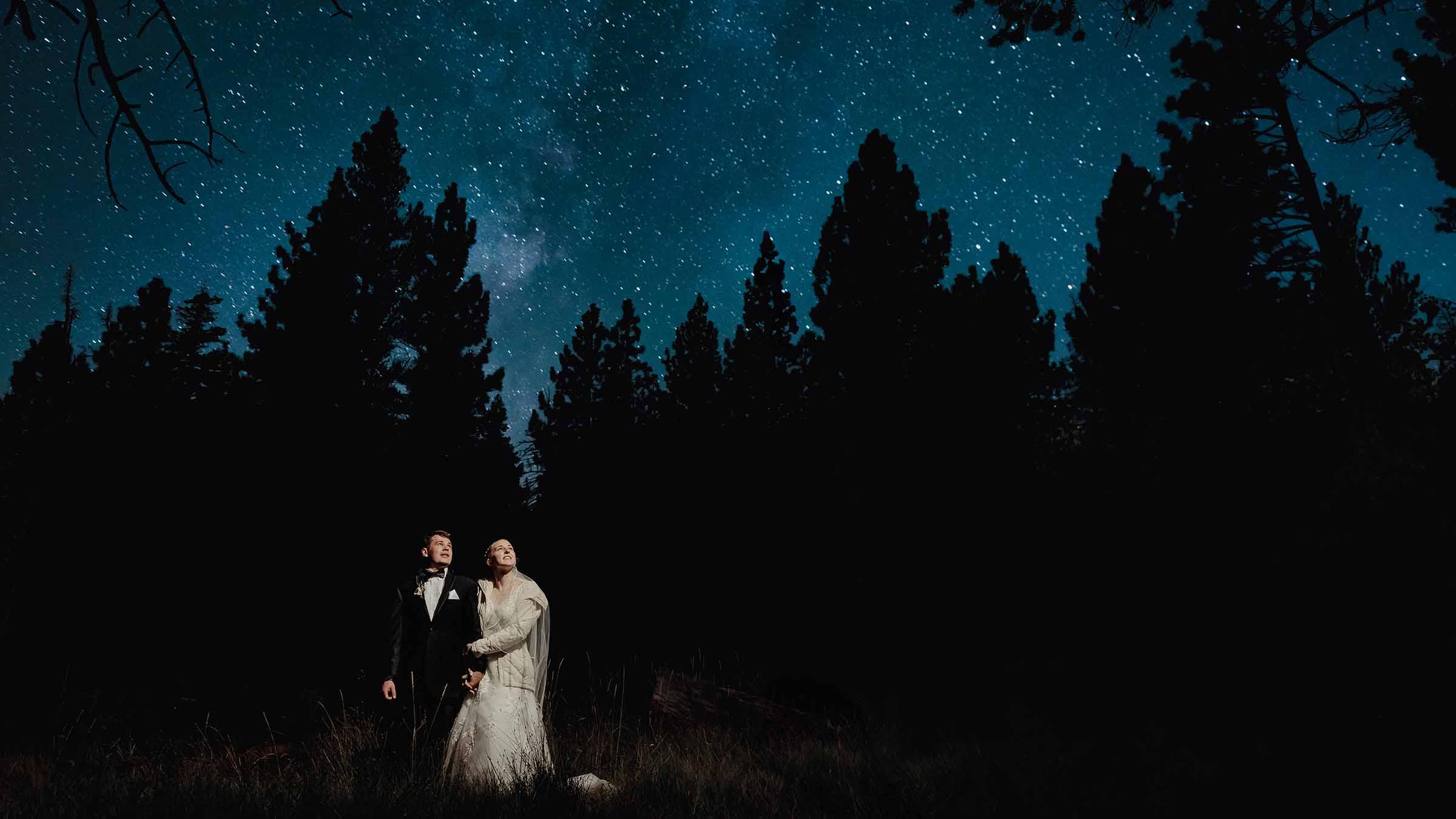 Bride and groom posing in front of the stars