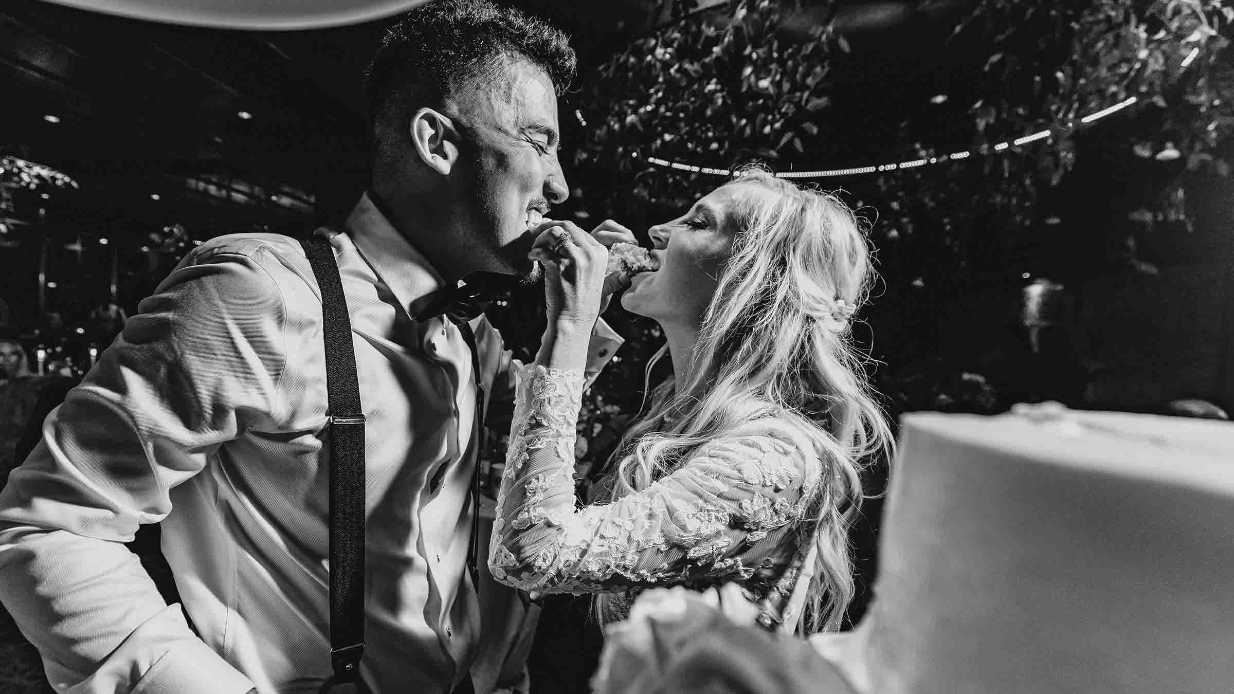 Bride and groom eating cake