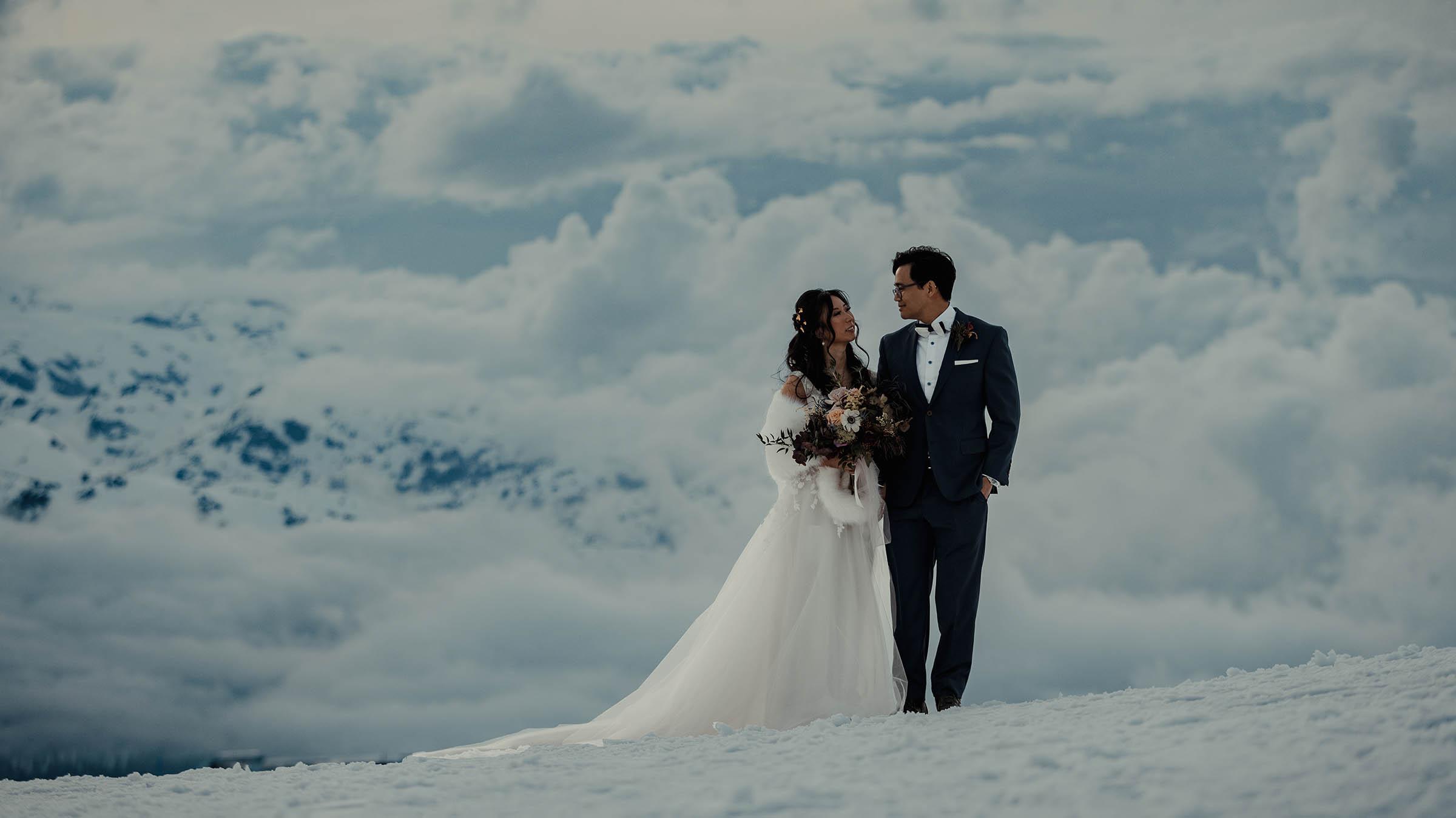 Bride and groom posing at the Mammoth Mountain summit